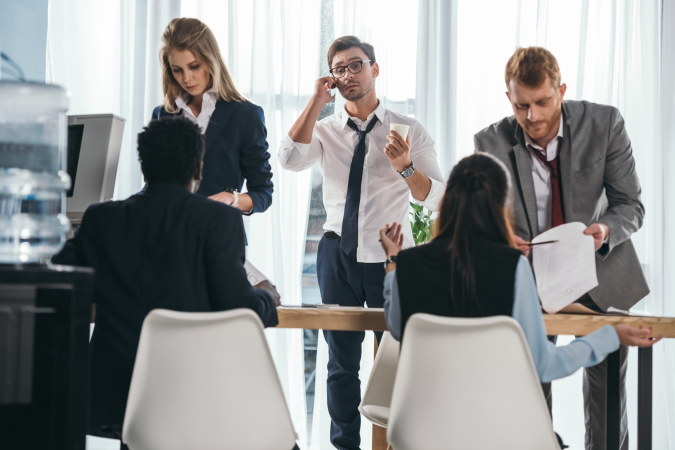 group-of-business-partners-having-conversation-at-office