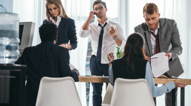 group-of-business-partners-having-conversation-at-office